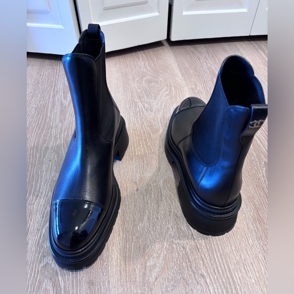 Chanel Chelsea boot. Black. Size 42. Never worn. Patent leather toe. Cc on back